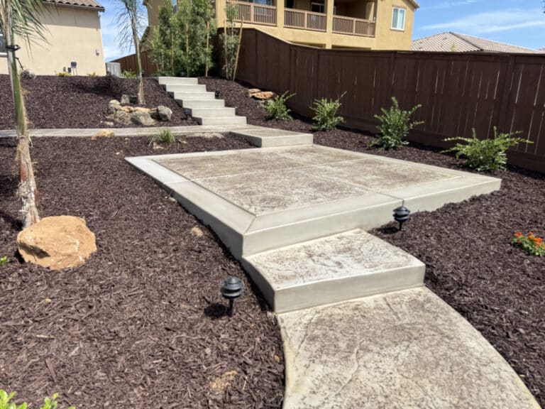 backyard landscaping with concrete work