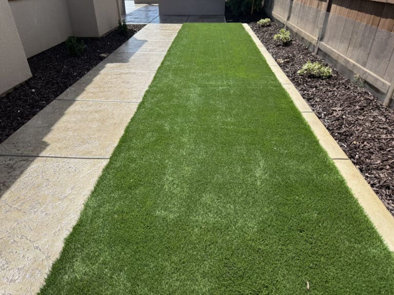 artificial grass installed in backyard