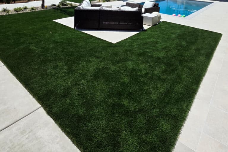 artificial grass installed in backyard with pool