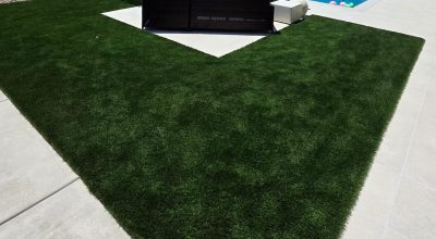artificial grass installed in backyard with pool